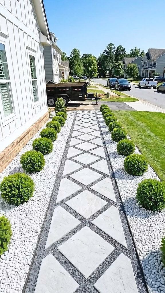 UCB Diamond Paver — white diamond-shaped concrete paving slabs laid in a landscaped garden path by Unique Concrete Builders Kenya