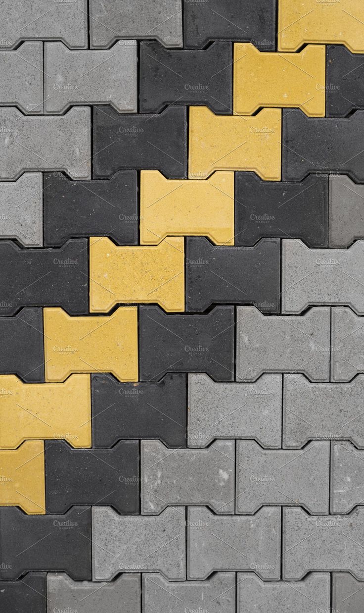 UCB Double T Paver — yellow, black and grey Double T interlocking concrete pavers by Unique Concrete Builders Kenya