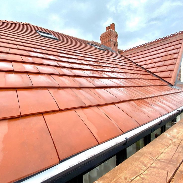 smooth red clay roof tiles installed on a house roof by Unique Concrete Builders Kenya