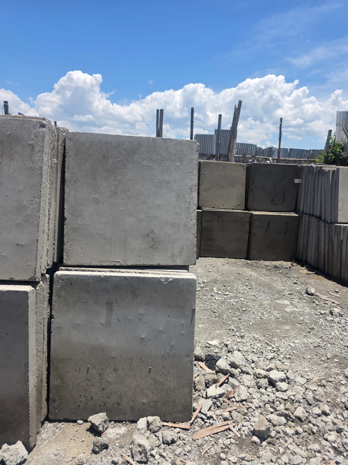 UCB Paving Slabs — concrete paving slabs stacked in rows at the UCB production yard in Kenya