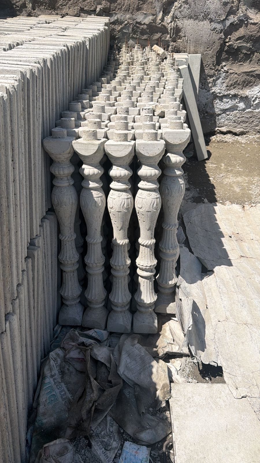 Ornate precast concrete balusters and spindles in the UCB production yard — decorative balustrade products by Unique Concrete Builders Kenya