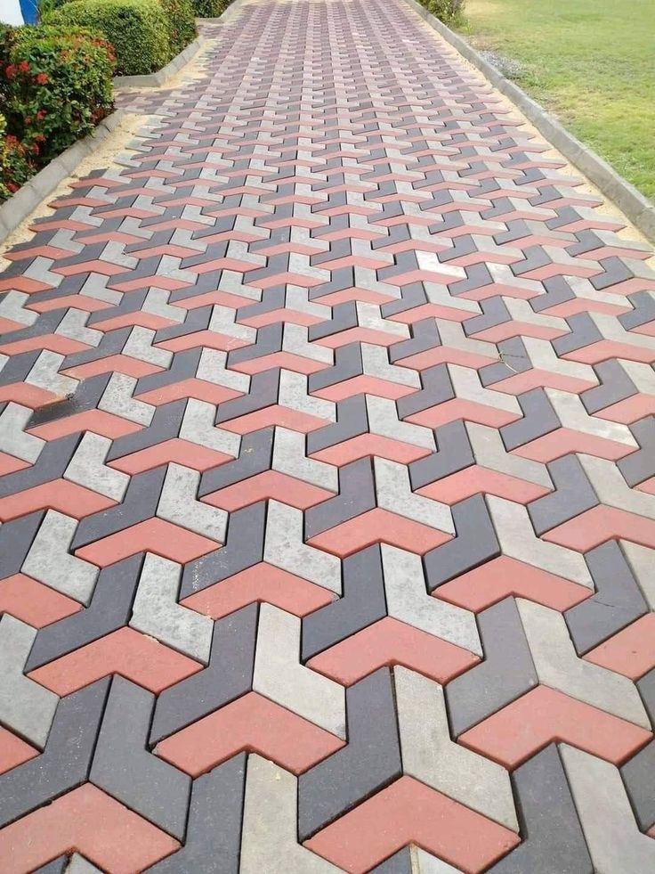 UCB Arrow Paver — arrow and chevron-shaped red, black and grey interlocking concrete pavers installed on a walkway by Unique Concrete Builders Kenya